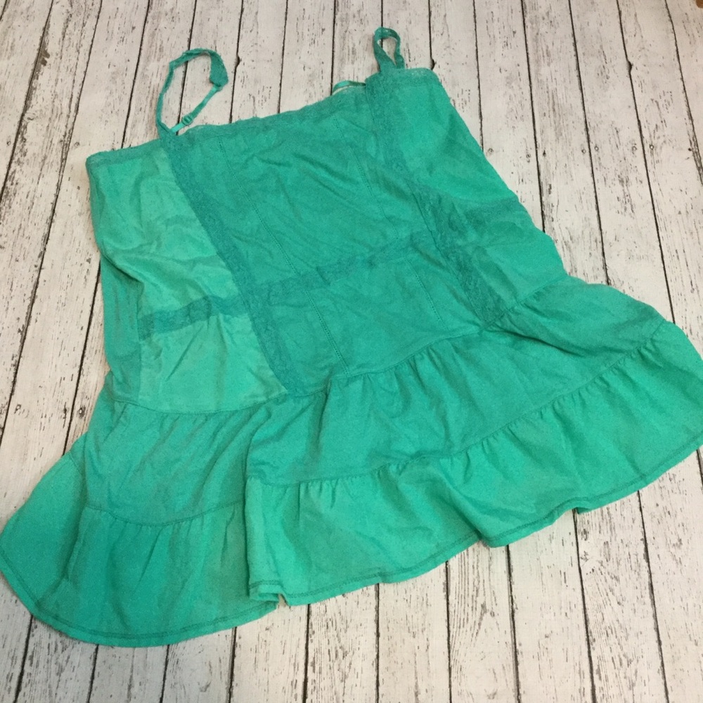 Strappy teal green tank top with lace accents.